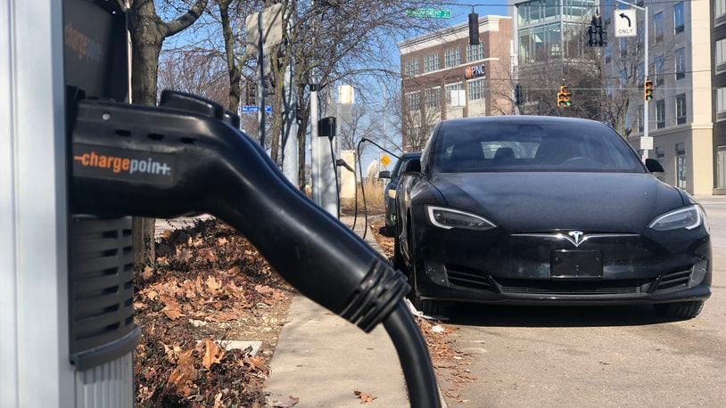 An electric vehicle charging station across from the Day Air Ballpark, where the Dayton Dragons play, in downtown Dayton. CORNELIUS FROLIK / STAFF