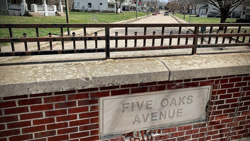 Dayton expects to repave far more miles of residential streets like parts of Five Oaks Avenue in 2022. MARSHALL GORBY\STAFF