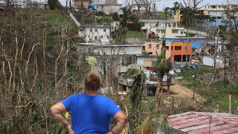 COROZAL, PUERTO RICO - SEPTEMBER 27: Irma Santiago surveys her neighborhood as people deal with the aftermath of Hurricane Maria on September 27, 2017 in Corozal, Puerto Rico. Puerto Rico experienced widespread, severe damage including most of the electrical, gas and water grids as well as agricultural destruction after Hurricane Maria, a category 4 hurricane, passed through. (Photo by Joe Raedle/Getty Images)