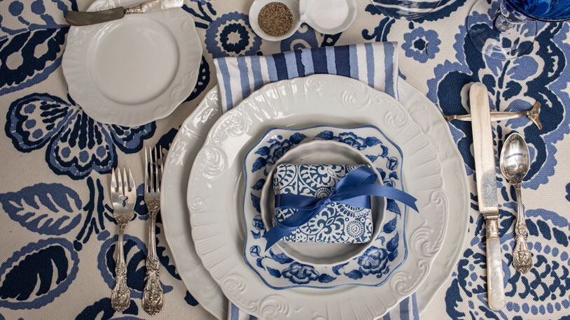 The place settings are super simple: everyday white plates topped with a sweet blue and white salad plate. (Mary Carol Garrity)