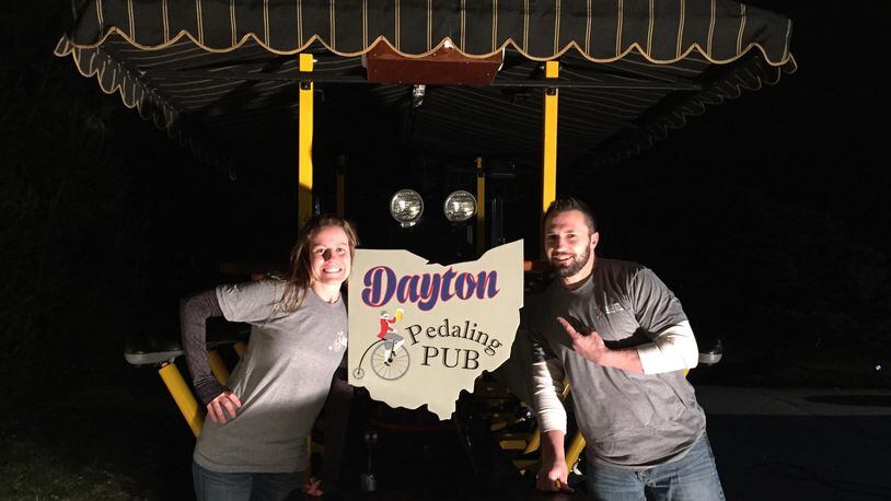 Local residents Lindsay Kleinhenz and Chad Banter were inspired to start their own pedal pub business, Dayton Pedaling Pub, after taking a tour around Nashville. CONTRIBUTED
