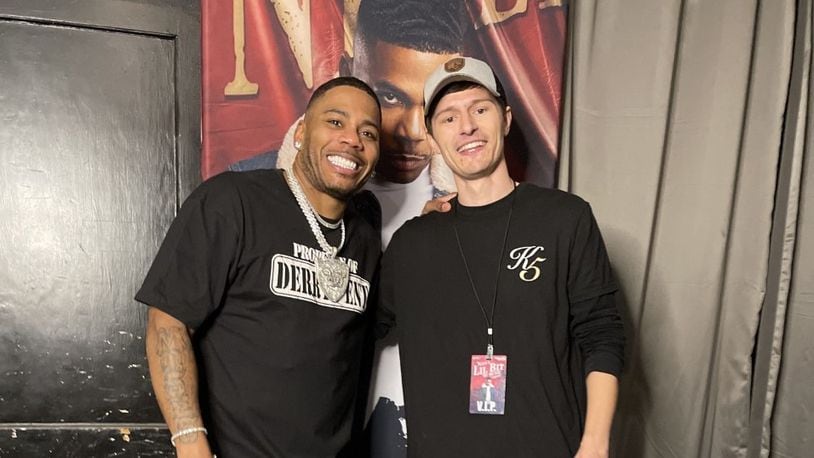 Grammy-winning musician Nelly (left) poses with Bluegrass Farmaceuticals Chief Technology Officer Jonathan Tumey following a Nov. 21, 2021 concert in Waco, Texas. Nelly partners with with Bluegrass Farmaceuticals, which has a Miamisburg location. CONTRIBUTED PHOTO