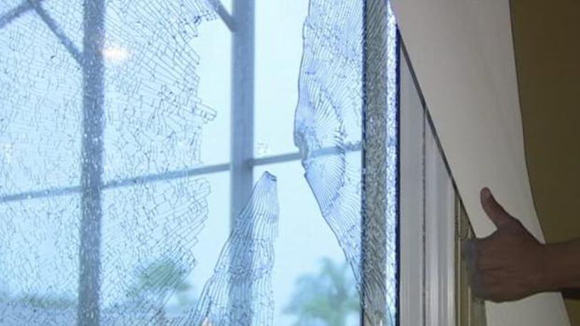 The windows of the home shot at by a former Florida police officer.