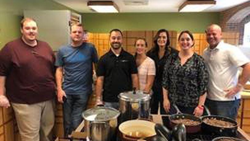 La-Z-Boy staff members from the region making a home-cooked meal for families of hospitalized children