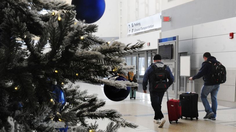 Holiday travel is projected to be up this year nationwide, including at the Dayton International Airport. STAFF FILE PHOTO