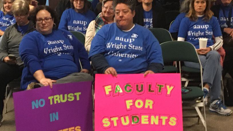 FILE: Wright State University faculty union members showed up with signs to a board of trustees meeting reccently. The union members are protesting ongoing contract negotiations with the administration.