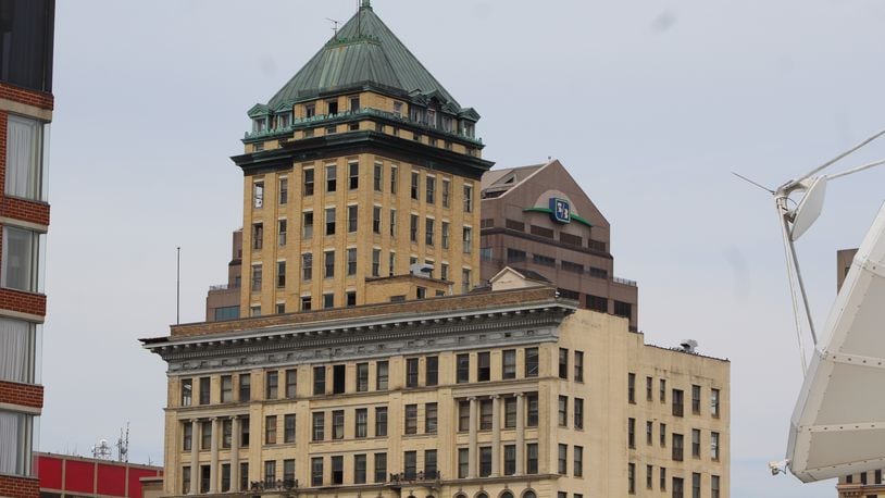 The Centre City building in downtown Dayton plans to seek $5 million in state historic tax credits. But the project previously won an award that it had to forfeit after failing to make progress. CORNELIUS FROLIK / STAFF