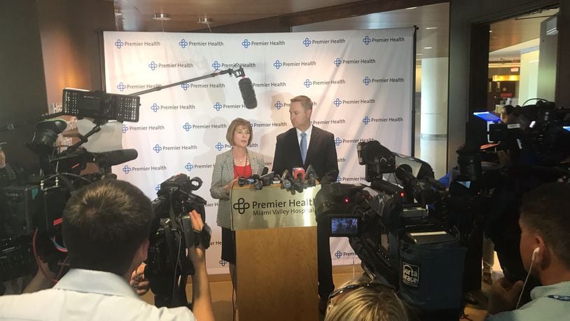 Mary Boosalis, CEO of Premier Health, left, and Mike Uhl, president of Miami Valley Hospital, speak to reporters following President Donald Trump’s visit. KAITLIN SCHROEDER