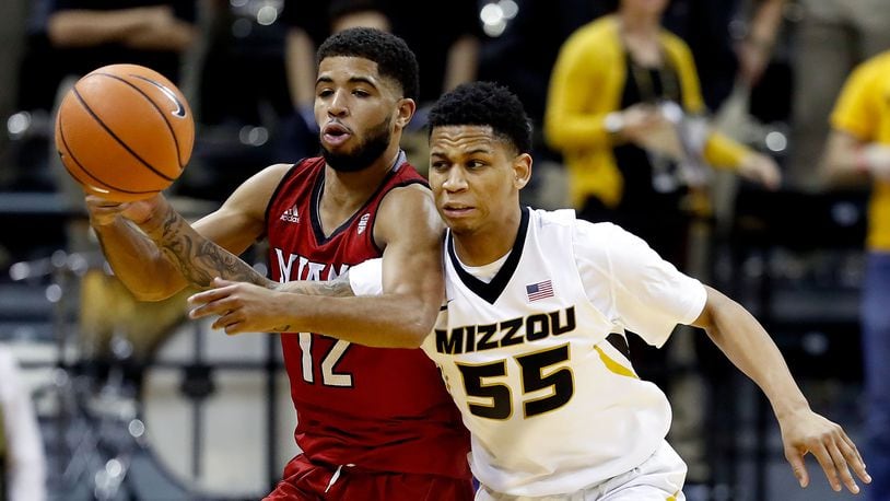 COLUMBIA, MO - DECEMBER 05: Blake Harris #55 of the Missouri Tigers steals the ball from Darrian Ringo #12 of the Miami (Oh) Redhawks during the game at Mizzou Arena on December 5, 2017 in Columbia, Missouri. (Photo by Jamie Squire/Getty Images)