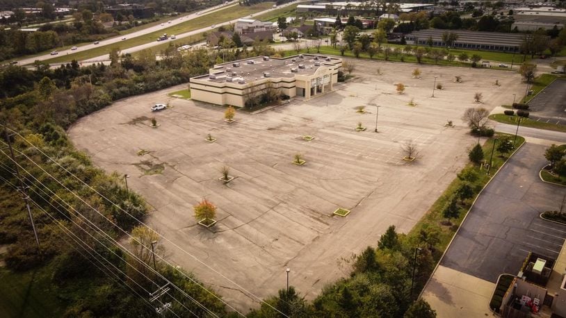 Kenwood Lincoln-Mercury LLC bought the former Danbarry Cinemas building along with about eight acres at 8300 Lyons Ridge Rd. in Miami Twp. Area business owners are divided about whether or not a car dealership is something that fits in the area. JIM NOELKER/STAFF