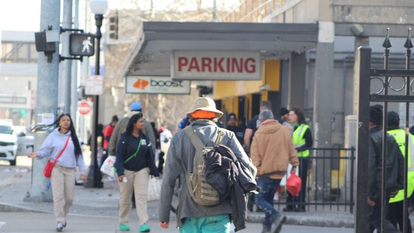 People walk by Wright Stop Plaza, Greater Dayton Regional Transit Authority's downtown transit center. CORNELIUS FROLIK / STAFF