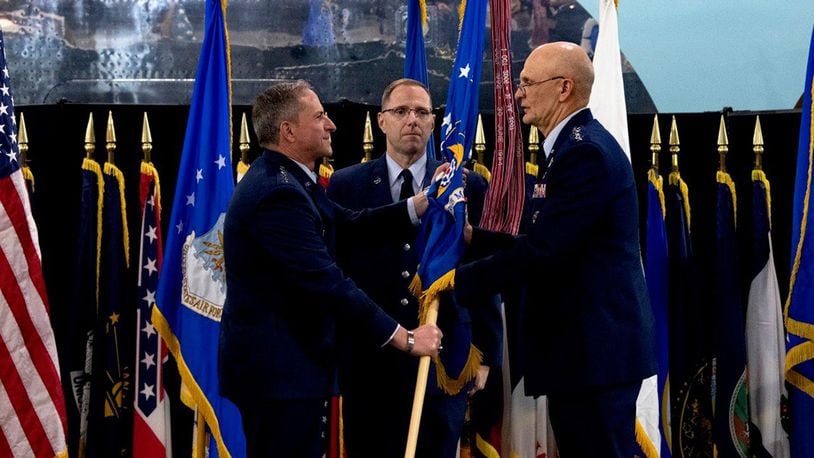 Air Force Chief of Staff Gen. David L. Goldfein passes the flag to Gen. Arnold W. Bunch Jr. as Bunch assumes command of Air Force Materiel Command during a ceremony at the National Museum of the U.S. Air Force May 31. Bunch took command of AFMC after serving as the deputy to the Assistant Secretary of the Air Force for Acquisition, Technology, and Logistics at the Pentagon. (U.S. Air Force photo/Scott M. Ash)