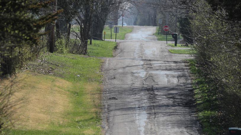 All or parts of seven roads totaling about 3.6 miles are set to be resurfaced including Snake Road in Trotwood. JIM NOELKER/STAFF