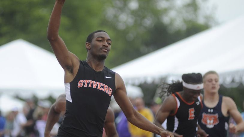 Tyler Johnson of Stivers (left) signals who’s No. 1 after winning the 200 during the D-II state track meet at OSU’s Jesse Owens Memorial Stadium at Columbus on Saturday, June 4, 2016. MARC PENDLETON / STAFF