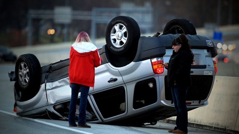 One person was injured in a rollover accident Monday afternoon, Dec. 5, 2016, on Ohio 4 South at I-75 North in Dayton. The driver was taken to Miami Valley Hospital. (Jim Noelker/Staff)