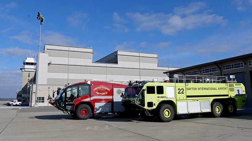 A yellow aircraft-rescue firefighting vehicle belonging to the City of Dayton Airport Fire Department is parked alongside other Wright-Patterson AFB Fire Department vehicles Dec. 8. Dayton loaned the ARFV to the 788th Civil Engineer Squadron when two of its firefighting vehicles went out of service due to mechanical problems. U.S. AIR FORCE PHOTO/TY GREENLEES