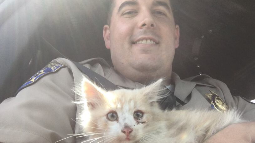 Officer Smith with Bridges the kitten.
