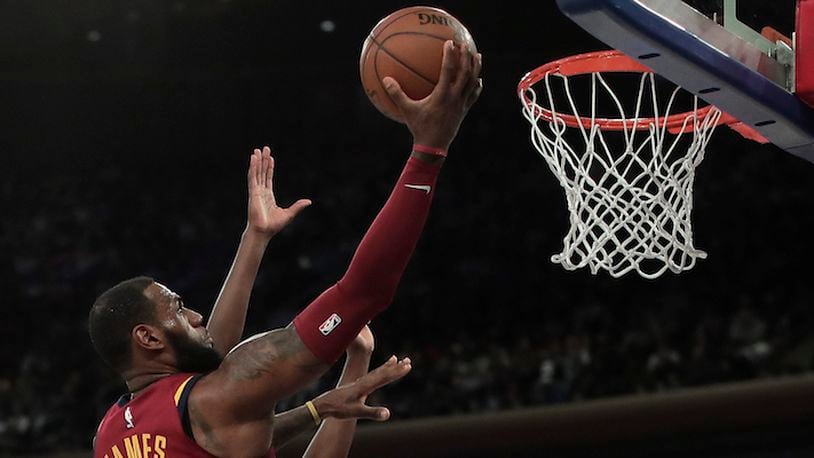 Cleveland Cavaliers forward LeBron James (23) puts up a shot against the New York Knicks during the second quarter of an NBA basketball game, Monday, April 9, 2018, in New York. The Cavaliers won 123-109. (AP Photo/Julie Jacobson)