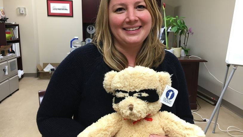 Lauren Matus, development officer at the Middletown Community Foundation, said “Ready Teddy” bears can be used to “start talking about the bigger issues” surrounding early childhood development. RICK McCRABB/STAFF