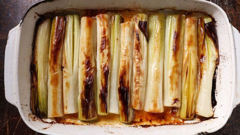 Leeks are roasted at high temperature before being bathed in broth then braised until silky and sweet. (Abel Uribe/Chicago Tribune/TNS)