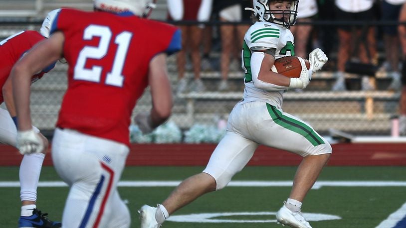 Badin's Jack Walsh rushes for a touchdown against Carroll. BILL LACKEY/STAFF