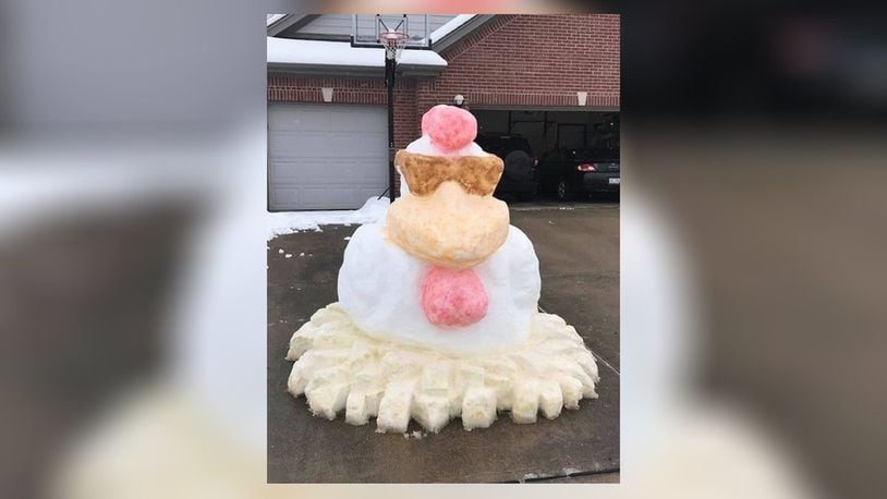 Kyla Bedel and Ken Bedel of Vandalia created this snow chicken after one of the snow storms that have came through this winter. CONTRIBUTED.