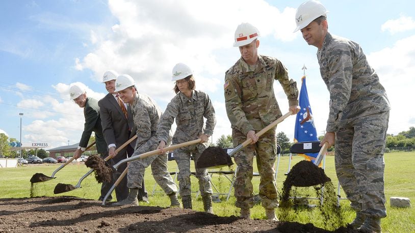 (From the left) William Butt, Butt Construction Co. president; David Perkins, 88th Civil Engineer Group director; Col. Corey Munro, 88th Medical Group Pharmacy commander; Col. Shari Silverman, 88th Medical Group commander; Lt. Col. Robert Newbauer, U.S. Army Corps of Engineers, Louisville District deputy commander; and Col. Bradley McDonald, 88th Air Base Wing commander, ceremonially break ground June 7 for the new Kittyhawk satellite pharmacy at Wright-Patterson Air Force Base. Construction completion is scheduled for the fall of 2018. (U.S. Air Force photo/Al Bright)