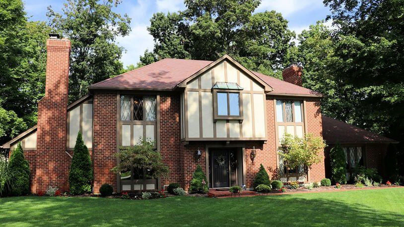Several updates have been made to the brick, 2-story home, including the kitchen flooring, garage door, heating and cooling systems and fireplace chimneys. The 4-bedroom house has a side-entry, 3-car garage. CONTRIBUTED PHOTOS BY KATHY TYLER