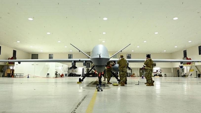An airman assigned to the Mississippi Air National Guard's 163rd Attack Wing perform post-flight checks on an MQ-9 Reaper Mar. 12, 2024 at the 178th Wing in Springfield, Ohio. This is the first time the remotely-piloted drone has landed at the wing. CONTRIBUTED