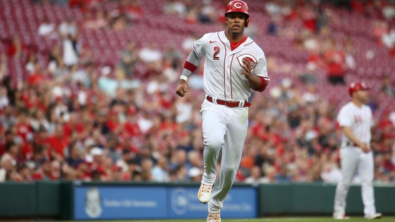 Jose Barrero, of the Reds, scores on a single by Spencer Steer in the third inning against the Phillies on Thursday, April 13, 2023, at Great American Ball Park in Cincinnati. David Jablonski/Staff