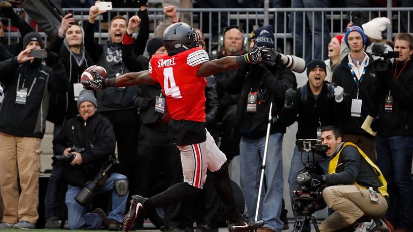 COLUMBUS, OH - NOVEMBER 26: Curtis Samuel #4 of the Ohio State Buckeyes scores the winning touchdown in double overtime against the Michigan Wolverines at Ohio Stadium on November 26, 2016 in Columbus, Ohio. (Photo by Gregory Shamus/Getty Images)