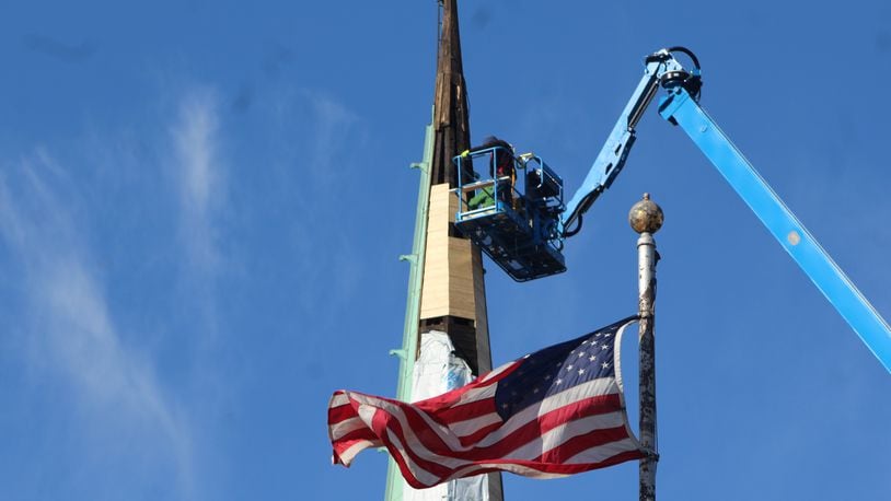 A crew works on a spire at the First Baptist Church of Dayton on Monument Avenue in downtown Dayton in November 2023. Construction work has some workplace risks. CORNELIUS FROLIK / STAFF