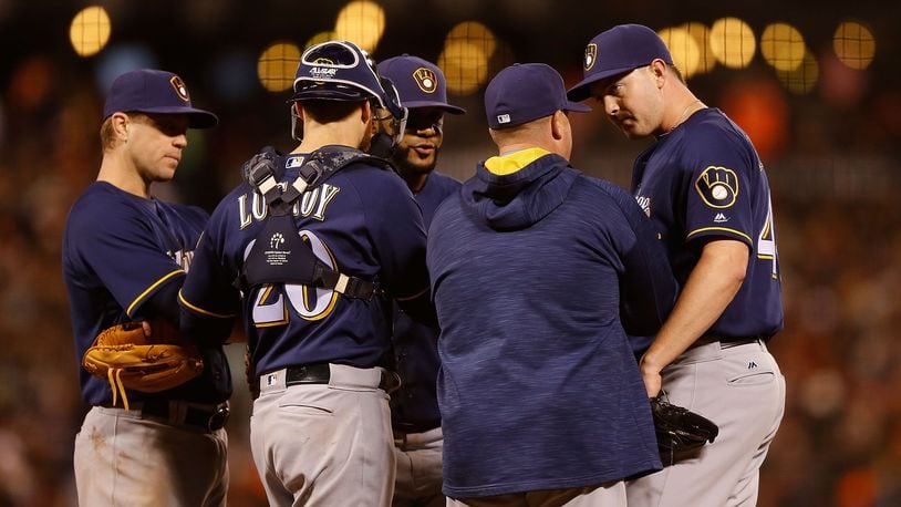 SAN FRANCISCO, CA - JUNE 14: Corey Knebel #46 of the Milwaukee Brewers talks to Pitching Coach Derek Johnson #36 of the Milwaukee Brewers during the fifth inning against the San Francisco Giants at AT&T Park on June 14, 2016 in San Francisco, California. (Photo by Lachlan Cunningham/Getty Images)
