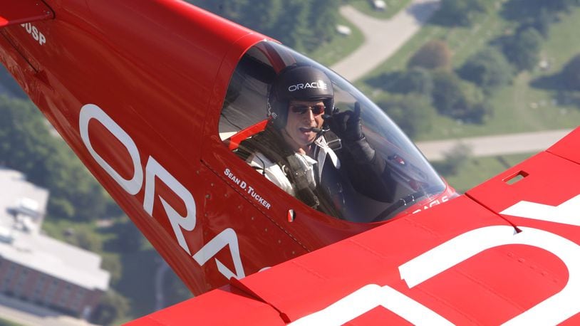 Sean D. Tucker in a photo flight over Dayton. TY GREENLEES / STAFF