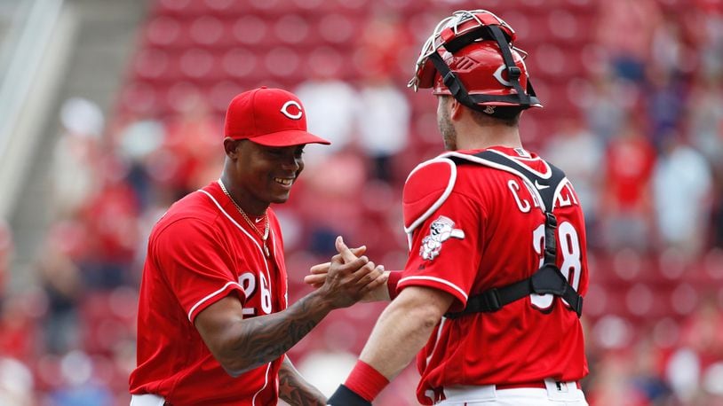 Reds closer Raisel Iglesias celebrates with Curt Casali after the final out in the ninth inning against the Philadelphia Phillies at Great American Ball Park on July 29, 2018 in Cincinnati, Ohio. The Reds won 4-0. (Photo by Joe Robbins/Getty Images)