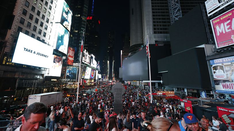 Screens in Times Square are black during a power outage, Saturday, July 13, 2019, in New York. Authorities were scrambling to restore electricity to Manhattan following a power outage that knocked out Times Square's towering electronic screens and darkened marquees in the theater district and left businesses without electricity, elevators stuck and subway cars stalled.