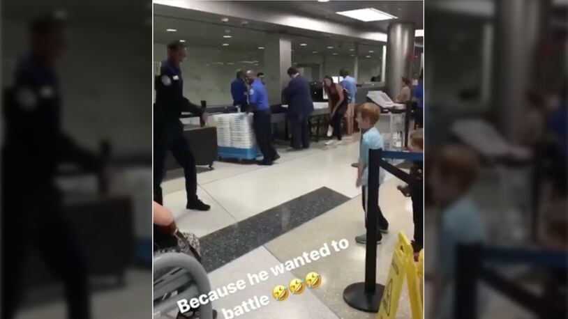 A TSA agent competed in a dance off at the Newark Liberty International Airport with a child going through security.