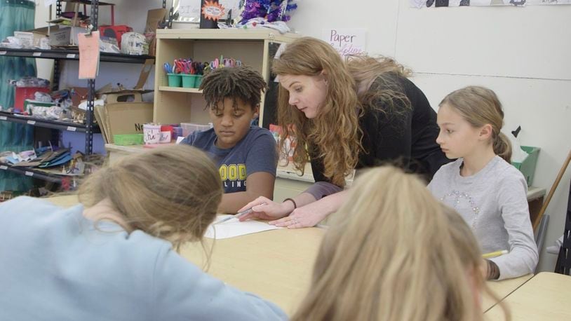 Art teacher Whitney Rivard works with students at Harman School on still-life drawing.  Respondents to an Oakwood schools survey indicated teachers were among the top sources of where they get information about the district. CONTRIBUTED