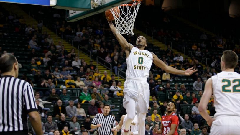 Wright State’s Steven Davis throwns down a dunk during Friday night’s victory against Detroit at the Nutter Center. TIM ZECHAR/SUBMITTED PHOTO
