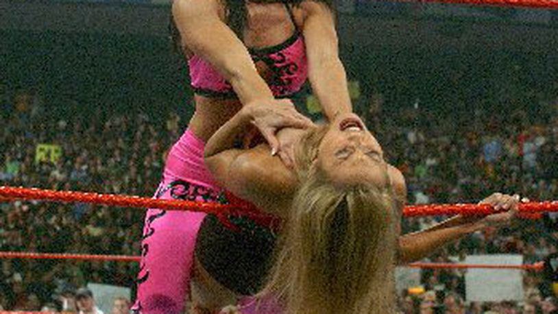 World Wrestling Entertainment wrestler Victoria employs a choke hold in a 2002 match with Stacy Keibler in Bridgeport, Conn. World Wrestling Entertainment has been built into an empire by Chairman Vince McMahon and his wife, Linda, the company’s former chief executive, who was just confirmed by the Senate to lead the Small Business Administration. AP