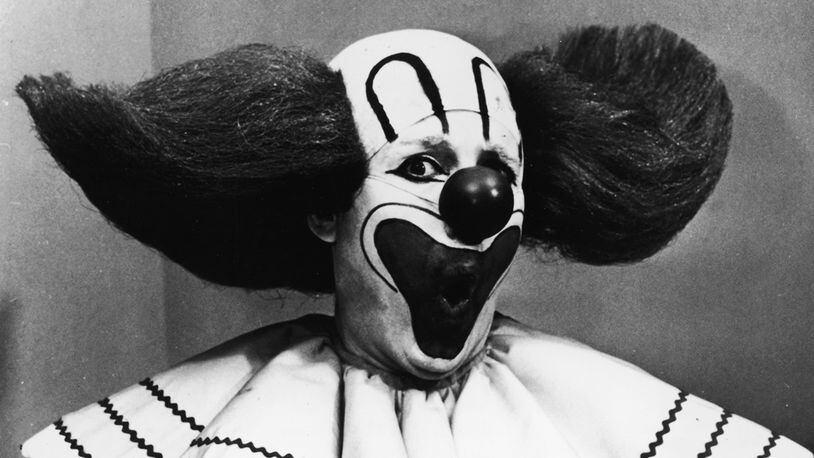 Promotional portrait of Bozo the Clown holding boxes of Bozo Express Bazooka bubble gum with a surprised expression on his face, circa 1965. Frank Avruch, who portrayed the clown, died at age 89. (Photo by Hulton Archive/Getty Images)