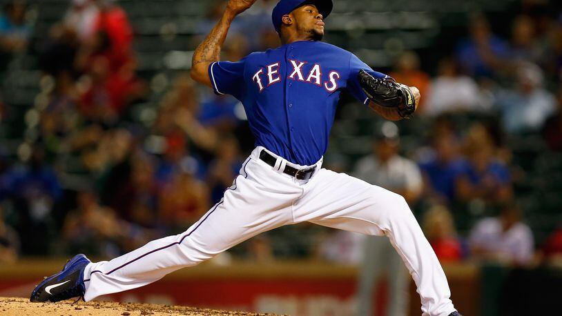 ARLINGTON, TX - SEPTEMBER 04: Lisalverto Bonilla #59 of the Texas Rangers pitches against the Seattle Mariners in the top of the seventh inning at Globe Life Park in Arlington on September 4, 2014 in Arlington, Texas. (Photo by Tom Pennington/Getty Images)