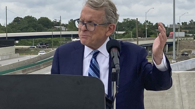 FILE - In this July 13, 2021 file photo, Ohio Gov. Mike DeWine promotes a new entrance ramp onto I-70 in Columbus, Ohio. A political stalemate over Ohio’s new legislative maps has plunged the state into confusion. As members of a new map-drawing commission defended themselves against potential contempt charges for failing to meet the latest court order requiring them to stop gerrymandering, top leaders were urging lawmakers to delay the May 3 primary. The bipartisan Ohio Redistricting Commission planned to meet again Wednesday, Feb. 23, 2022 and Thursday. (AP Photo/Andrew Welsh-Huggins, File)