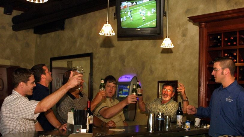 Hoisting Italian beer, a small gathering watch the World Cup soccer replay match between Mexico and Italy at Franco’s Ristorante Italiano at 824 E. 5th St. in Dayton. Owner Franco Germano, second from right also watched the game live at 7:30 a.m. with invited guests at the eatery. DDN FILE PHOTO