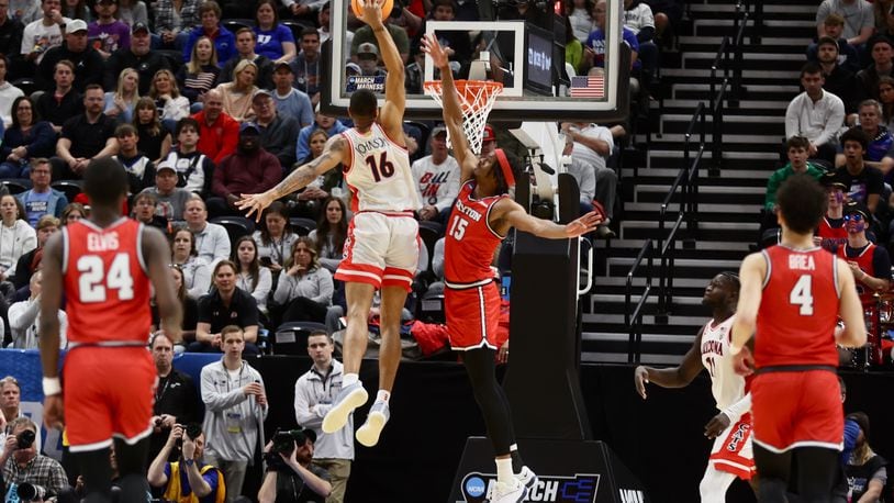 Arizona's Keshad Johnson misses a dunk against Dayton's DaRon Holmes II in the first half in the second round of the NCAA tournament on Saturday, March 23, 2024, at the Delta Center in Salt Lake City, Utah. David Jablonski/Staff