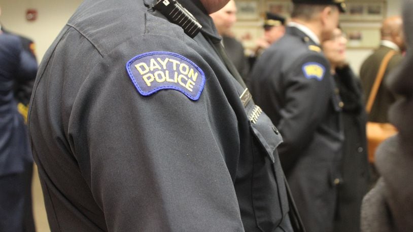 Dayton police at a city commission meeting. CORNELIUS FROLIK / STAFF