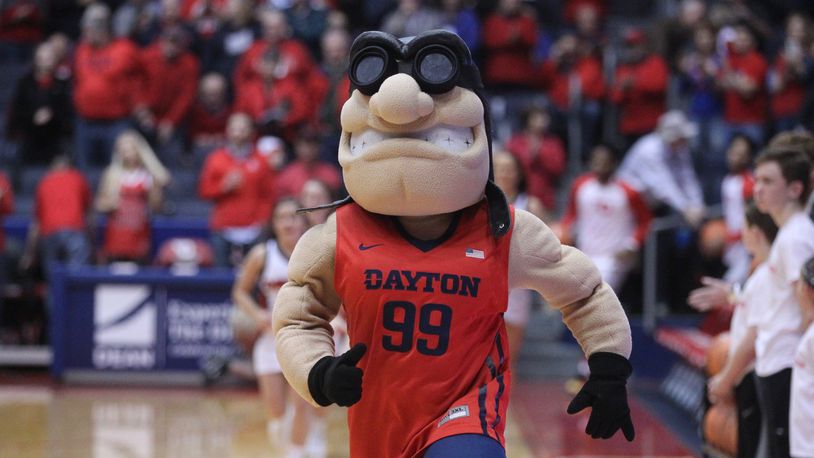 Dayton's mascot, Rudy Flyer, leads the team onto the court before a game against Tennessee Tech on Dec. 6, 2017, at UD Arena. David Jablonski/Staff