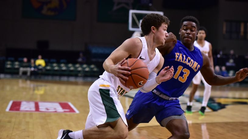 Wright State’s Cole Gentry tries to drive past Notre Dame College’s Larenz Thurman during Wednesday’s exhibition game at the Nutter Center. Joseph Craven/CONTRIBUTED