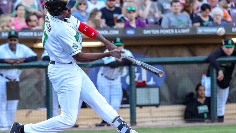 Dayton Dragons outfielder Mariel Bautista hits a home run in the first inning of their game against the Clinton LumberKings on Monday, May 6 at Fifth Third Field. The Dragons won 5-4. MICHAEL COOPER / CONTRIBUTED