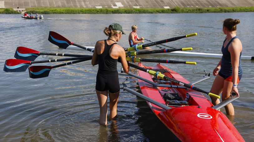 Annalie Duncomb, 16, from Mason, left, and Annelise Hahl, 16, from North Carolina, get ready for practice Thursday, Aug. 25, 2022 in Hamilton. Duncomb, Hahl and others with The Great Miami Rowing Club are heading to Wales where they will be training for and then competing in the 2022 World Coastal Championships and Beach Sprint Finals. NICK GRAHAM/STAFF